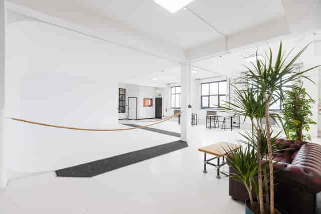 Modern event space in Spectrum Studios with natural light for gatherings and brainstorming.