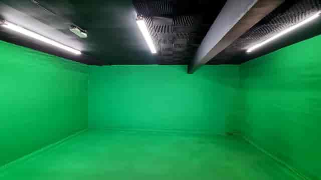 Green video production room for virtual events and livestreams at Imagine Media Network.
