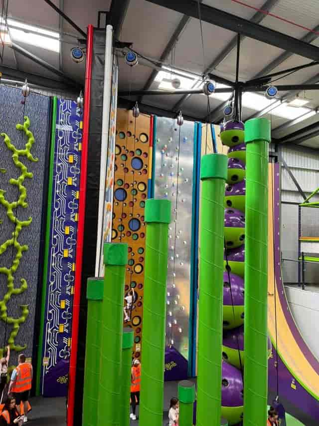 Indoor climbing facility at KickSonic for team-building events and corporate outings.