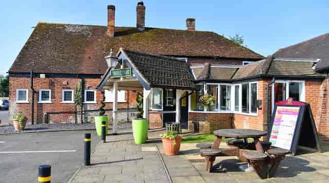 Charming Vine Inn pub with outdoor seating, perfect for intimate gatherings and events.