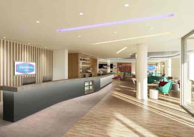 Modern lobby at Hampton by Hilton Manchester, ideal for conferences and networking.