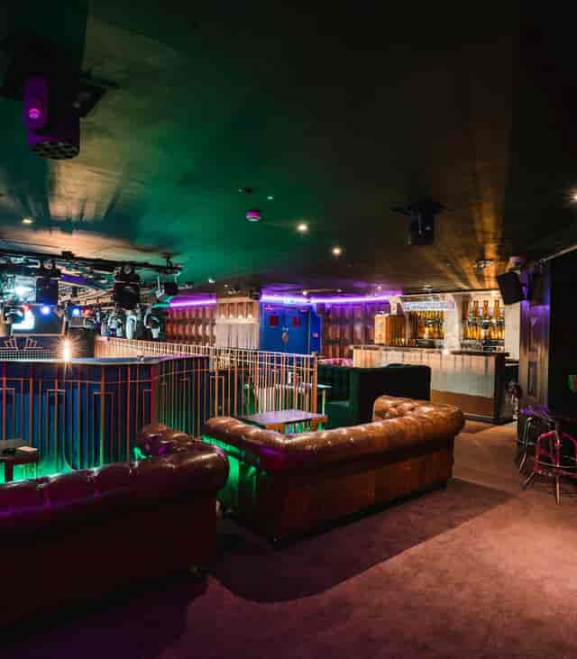 Modern event space with stylish lounge seating, perfect for corporate gatherings and celebrations.