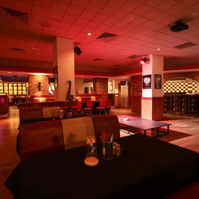 Dining area at Karen's Diner, warm ambiance for events and meetings.