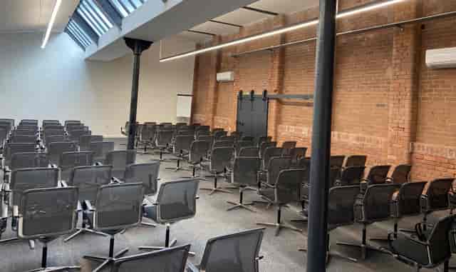 "Versatile conference room with ergonomic chairs and natural light at Ram Mill Business Centre."