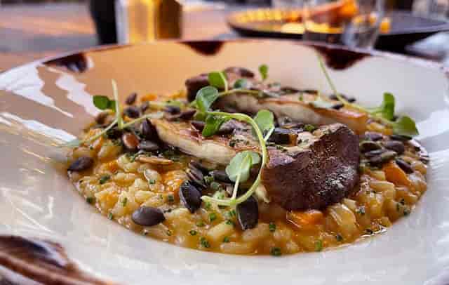 Creamy risotto with chicken and herbs at The Wayfarer restaurant, ideal for events.