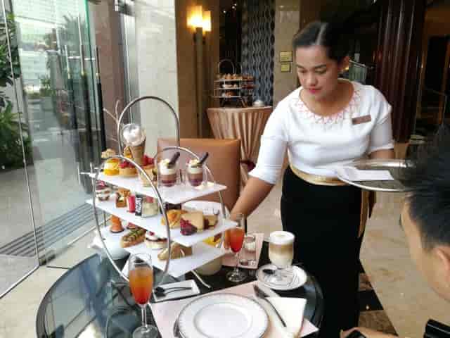 Elegant dessert display at Café Columbia, Beach Rotana, perfect for afternoon tea events.
