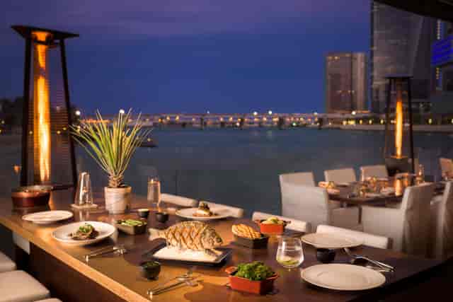 Upscale dining setup at Beach Rotana, ideal for corporate events and networking.
