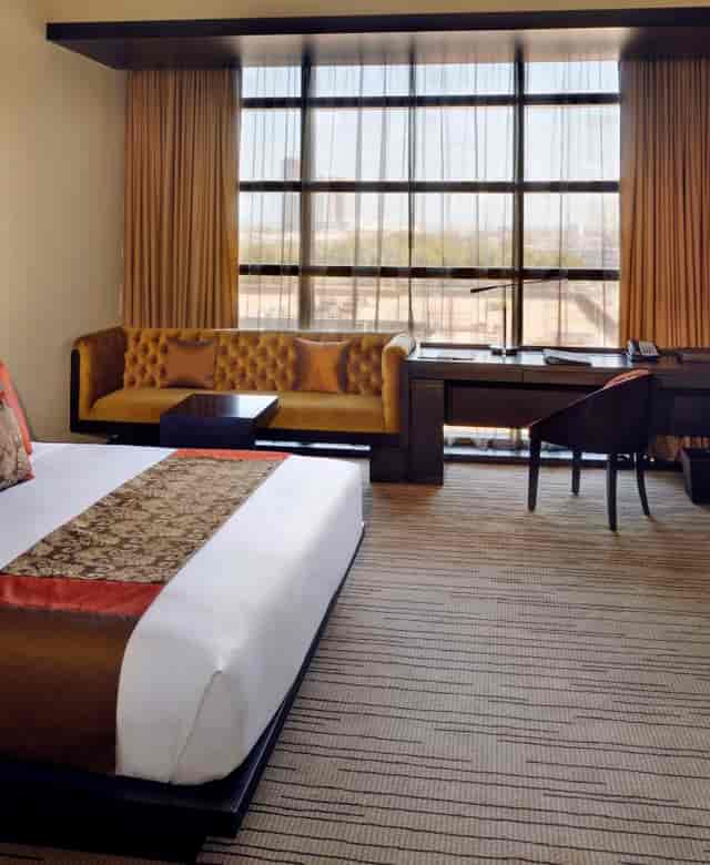 Luxury meeting room with plush bedding at Southern Sun Abu Dhabi hotel conference space.