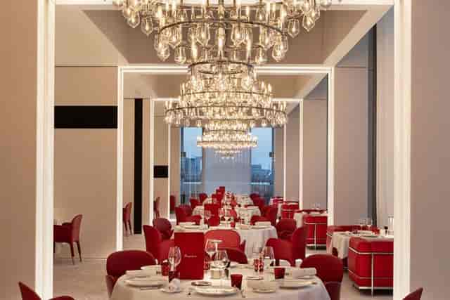 Elegant restaurant dining space with chandelier, perfect for upscale events in Abu Dhabi.