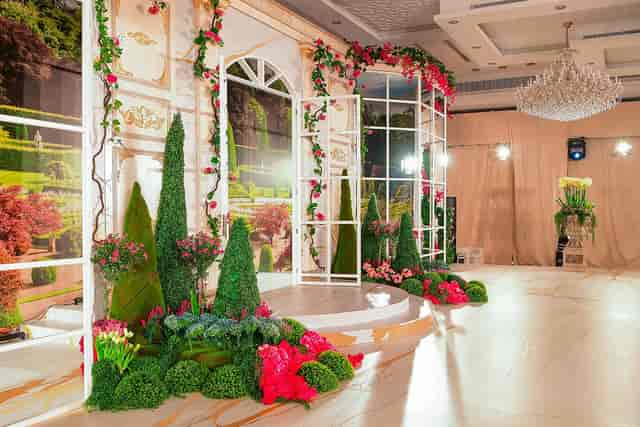 Gold Ballroom B with floral backdrop, ideal for weddings and corporate events.