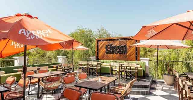 Vibrant outdoor event space with stylish furniture for networking receptions and casual meetings.