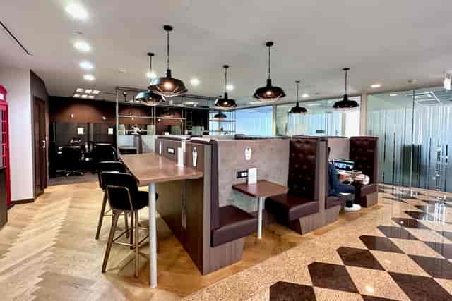 Modern co-working space with booth seating for networking events and workshops.