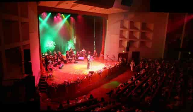 Vibrant theater stage set for live performance at Cultural Foundation event.