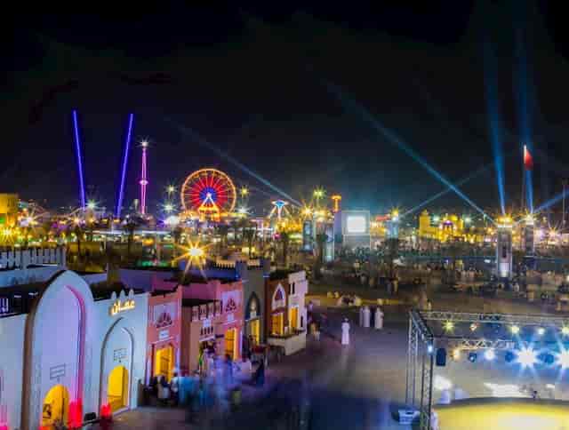 Sheikh Zayed Festival grounds with colorful lights and a Ferris wheel, perfect for events.