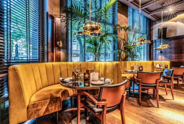 Sophisticated Ron Gastrobar dining space with plush seating for intimate gatherings.