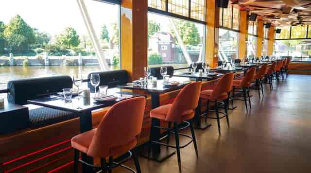 Stylish THC Restaurant + Bar in Amsterdam with waterfront views, perfect for events.