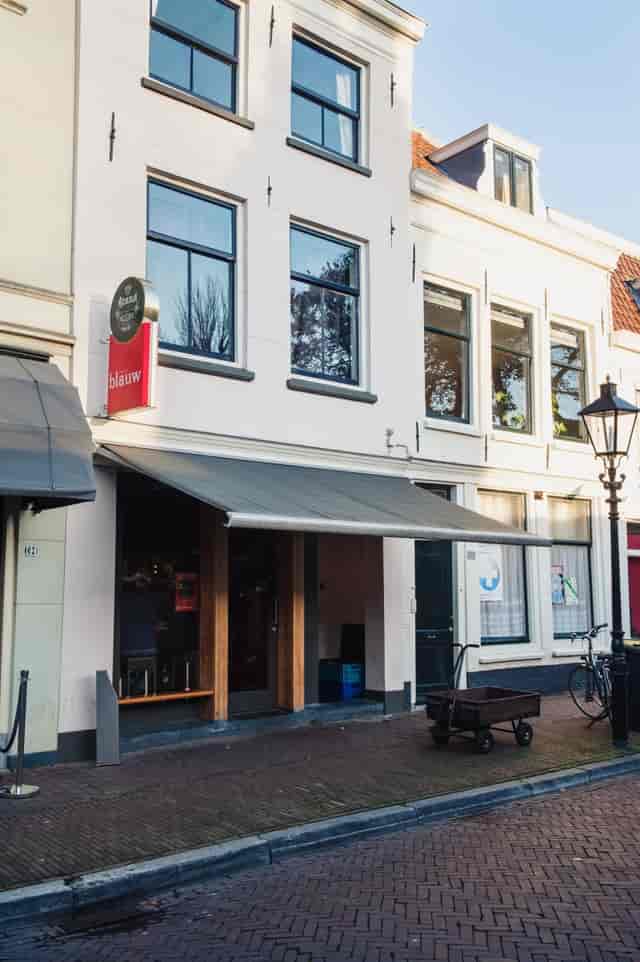 Cozy event space at Restaurant Blauw with large windows for networking and workshops.