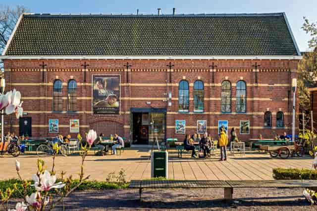 Vibrant cafe with brick architecture, perfect for meetings and community events.