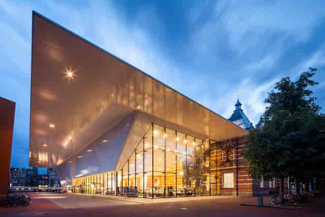 Modern event space at Stedelijk Museum with cantilevered roof, perfect for conferences.