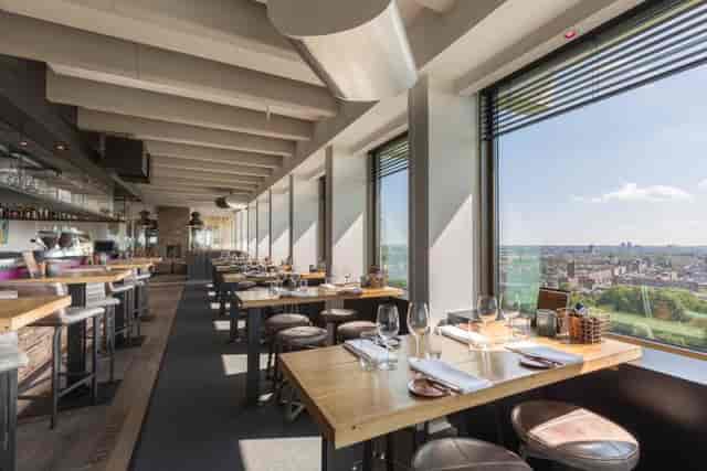 Modern restaurant with panoramic views, perfect for upscale events and gatherings.