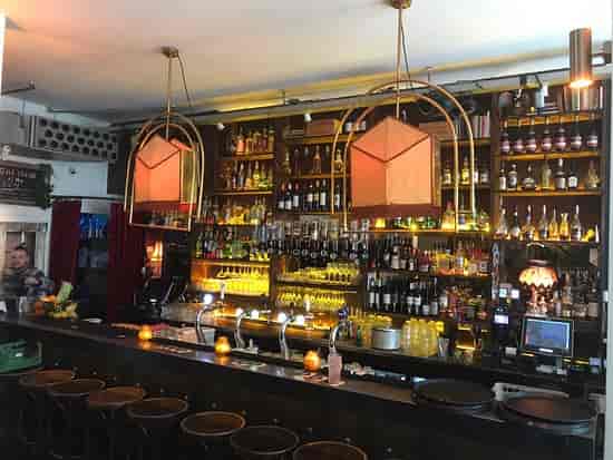 Stylish bar at Mata Hari, warm lighting for networking events and casual gatherings.