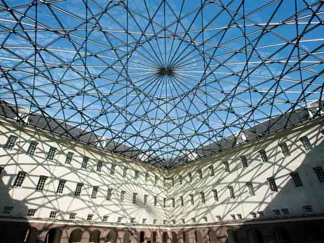 Stunning glass-roofed courtyard at Het Scheepvaartmuseum for events and exhibitions.
