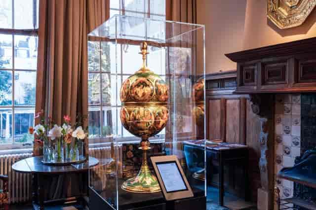 Elegant library with decorative piece, perfect for upscale events and gatherings.