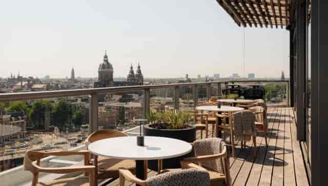 Rooftop terrace bar at Art Hotel Amsterdam with stunning city views for events and meetings.
