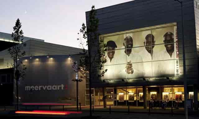 Modern Meervaart Theater exterior, illuminated for conferences and performances.