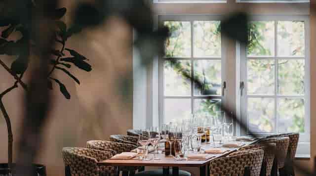 Elegant dining table at H'ART Museum Grand Café, ideal for intimate events and meetings.