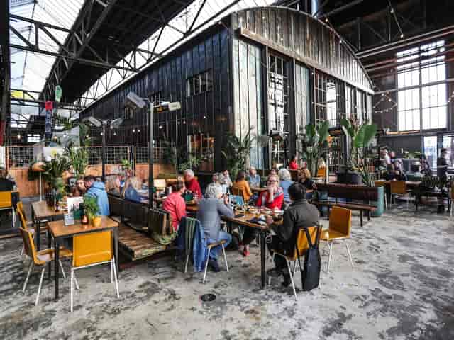 Vibrant industrial restaurant in IJver Amsterdam ideal for events and casual dining.