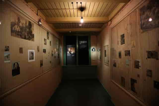 Anne Frank House exhibition hall with framed photos, perfect for themed events.