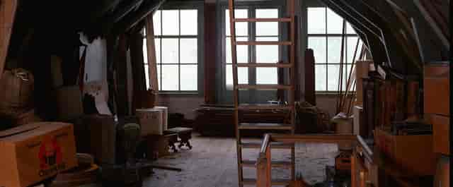 Secret Annex in Anne Frank House: rustic attic with beams, ideal for intimate events.