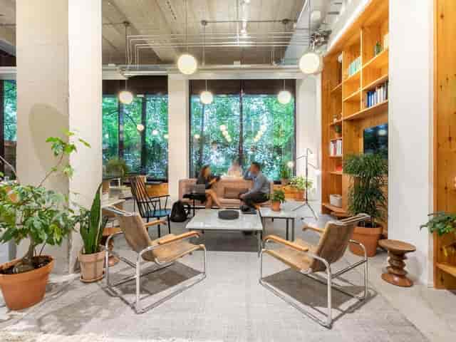 Modern coworking space with natural light, perfect for networking events and meetings.