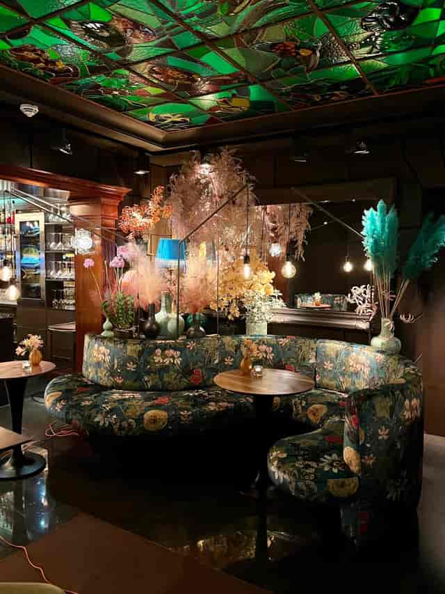 Elegant function room at Hotel Estheréa with floral sofa for events and gatherings.