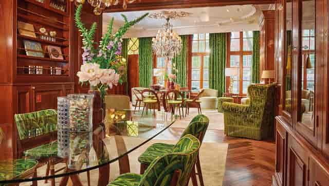 Elegant Herrenzimmer meeting space with wood paneling, ideal for corporate events.