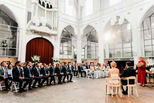 Wedding ceremony at Schuilkerk De Hoop, featuring elegant decor and romantic ambiance.