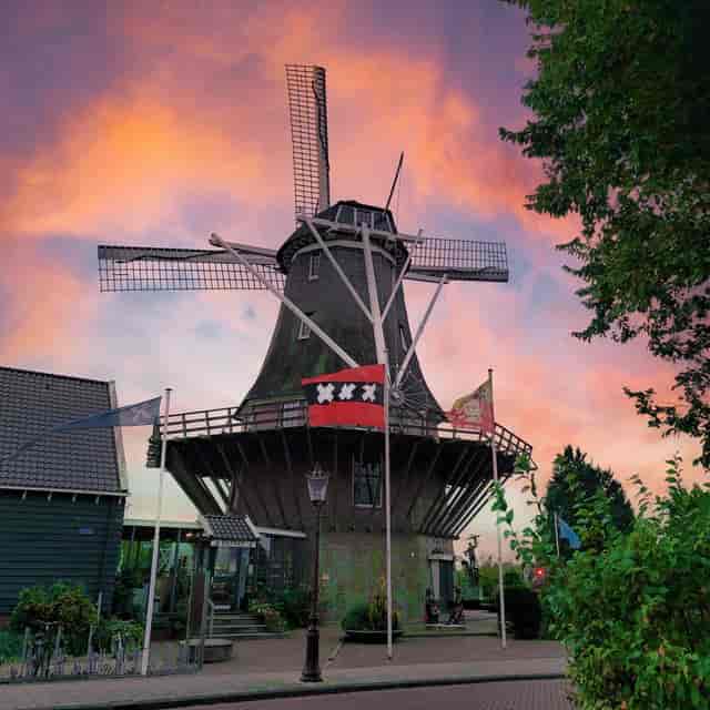 Charming windmill at sunset, perfect for themed events in Molen van Sloten.