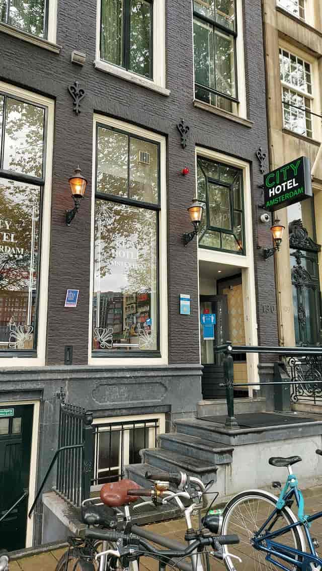 Elegant Amsterdam hotel lounge exterior with inviting lighting for events.