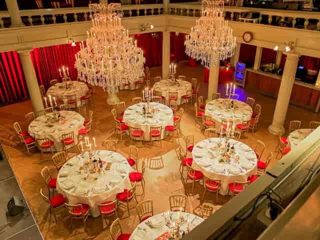 Elegant banquet hall with round tables for corporate events and galas.