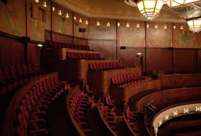 Elegant auditorium with tiered seating at Koninklijk Theater Tuschinski, ideal for performances.