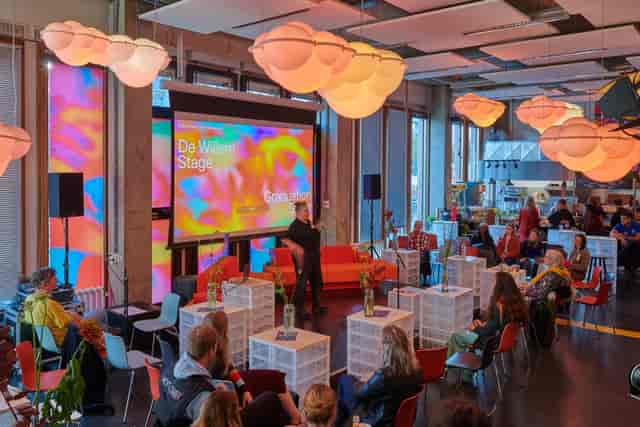 Vibrant event space at Willem de Kooning Academie, perfect for workshops and presentations.