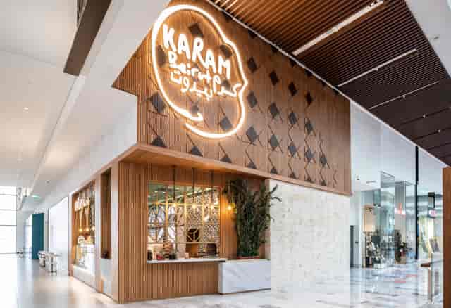 Stylish Central Kitchens entrance with wood accents for corporate events and networking.