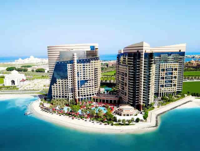 Luxurious poolside gardens at Khalidiya Palace Rayhaan for events and conferences.