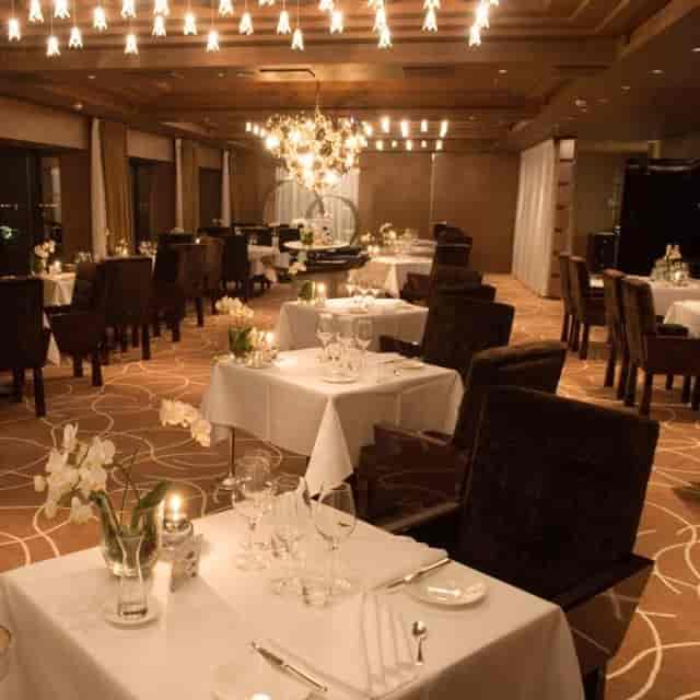 Elegant Ciel Bleu Restaurant setting with fine china for upscale dining events.