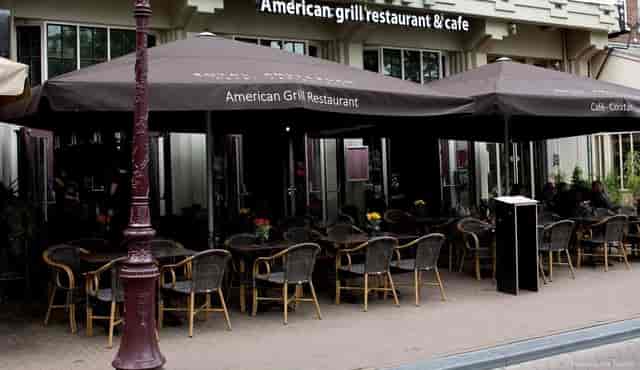 Outdoor dining area at Royal Amsterdam grill restaurant, perfect for casual networking.