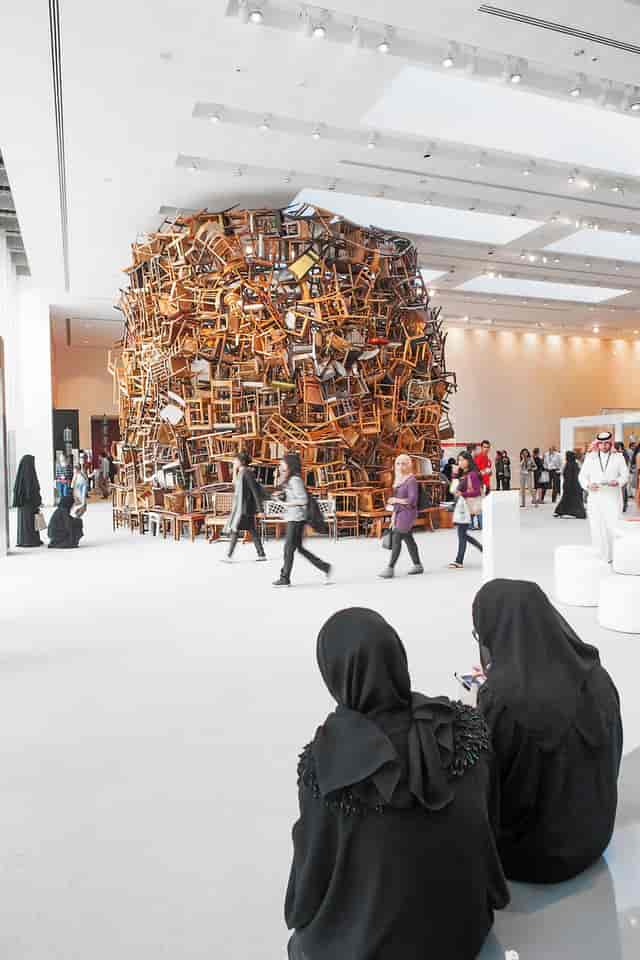 Striking chair installation at Abu Dhabi Art workshops for networking and creativity.