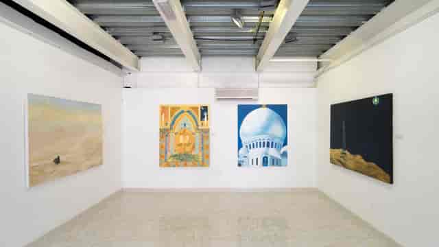 Contemporary art gallery in Abu Dhabi, featuring bright paintings for exhibitions and events.