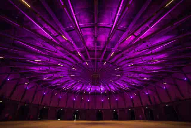 Gashouder event space with circular purple ceiling, ideal for corporate and social events.