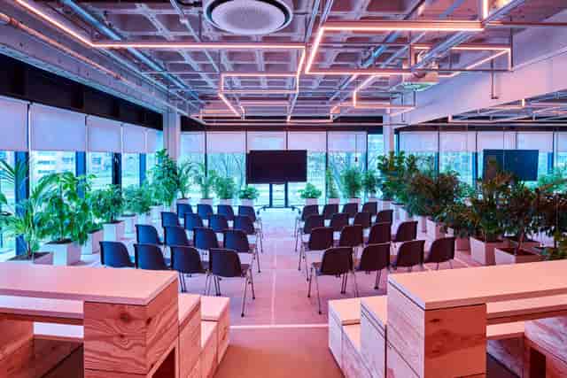 Modern event space at Bright Lab, B. Amsterdam with sleek chairs and natural light.